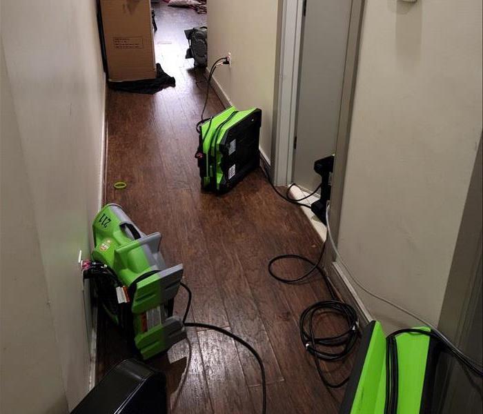 Air Movers Placed on Walls Down a Hallway